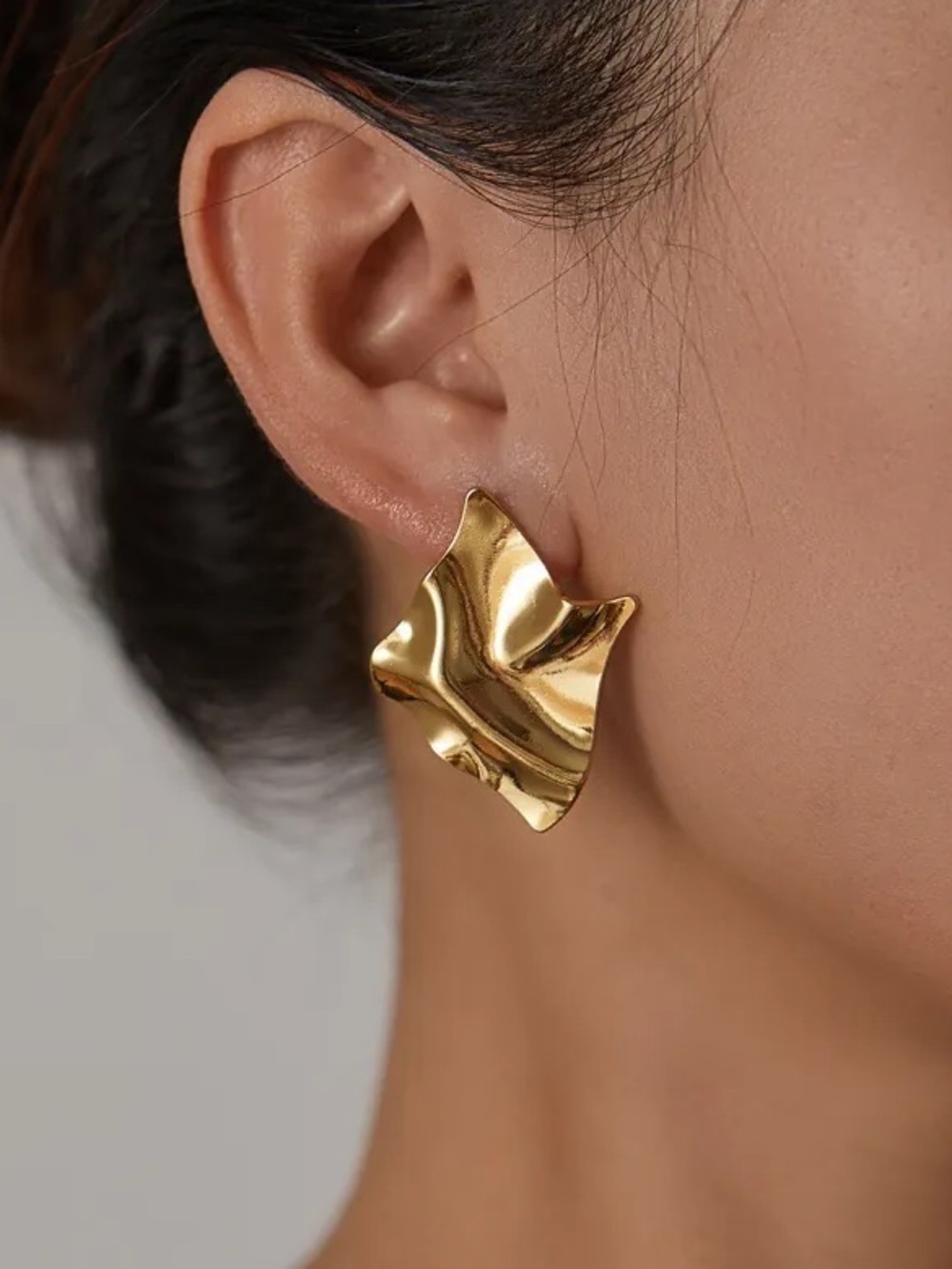 Gold Sculptural Wave Stud Earrings.